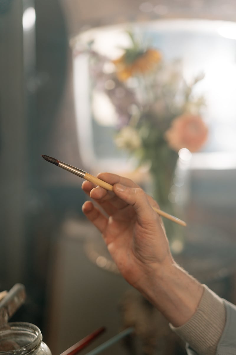 Person Holding a Paintbrush